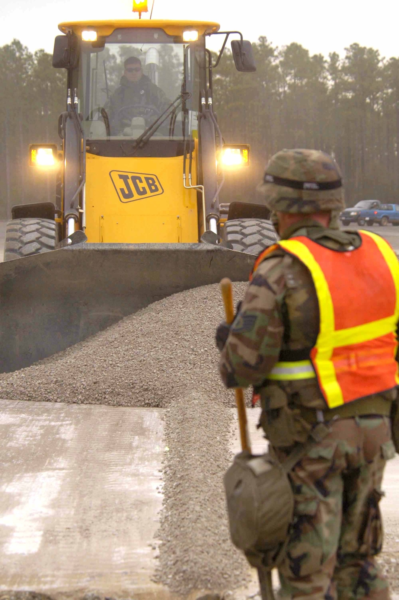 EGLIN AIR FORCE BASE, Fla. -- Staff Sgt. Charles Cahoon guides a front-end loader as it fills a crater.  He is a 796th Civil Engineer Squadron pavement and construction equipment operator.  (U.S. Air Force photo by Michelle Williams)