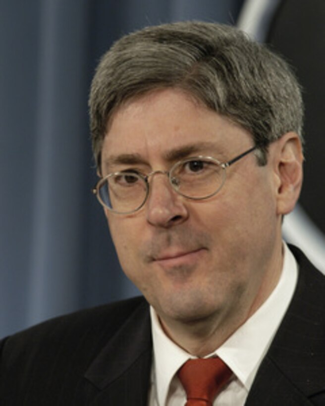 Under Secretary of Defense for Policy Douglas J. Feith listens to a reporter's question during his briefing on National Defense Strategy and National Military Strategy in the Pentagon on March 18, 2005. Feith states that these strategies outline an active, layered approach to the defense of the nation and its interests. 