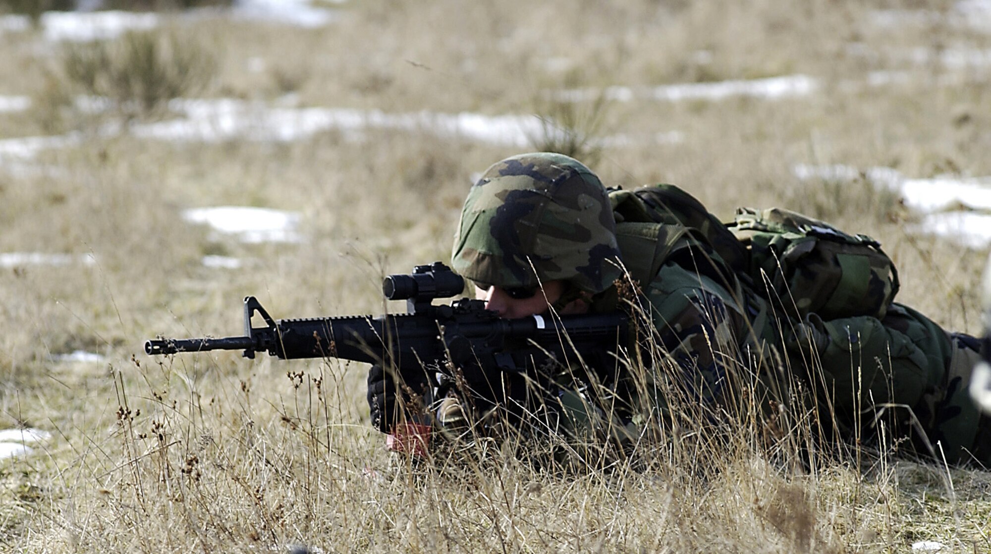 BAUMHOLDER, Germany -- Staff Sgt. James Howard fires at range targets during a simulated frontal ambush during live-fire training at a training range here March 14.  All deployable U.S. Air Forces in Europe security forces Airmen receive this training as part of their air and space expeditionary force certification.  The course prepares the Airmen to perform defensive operations.  Sergeant Howard is assigned to the 786th Security Forces Squadron at nearby Ramstein Air Base.  (U.S. Air Force photo by Tech. Sgt. Rich Puckett)