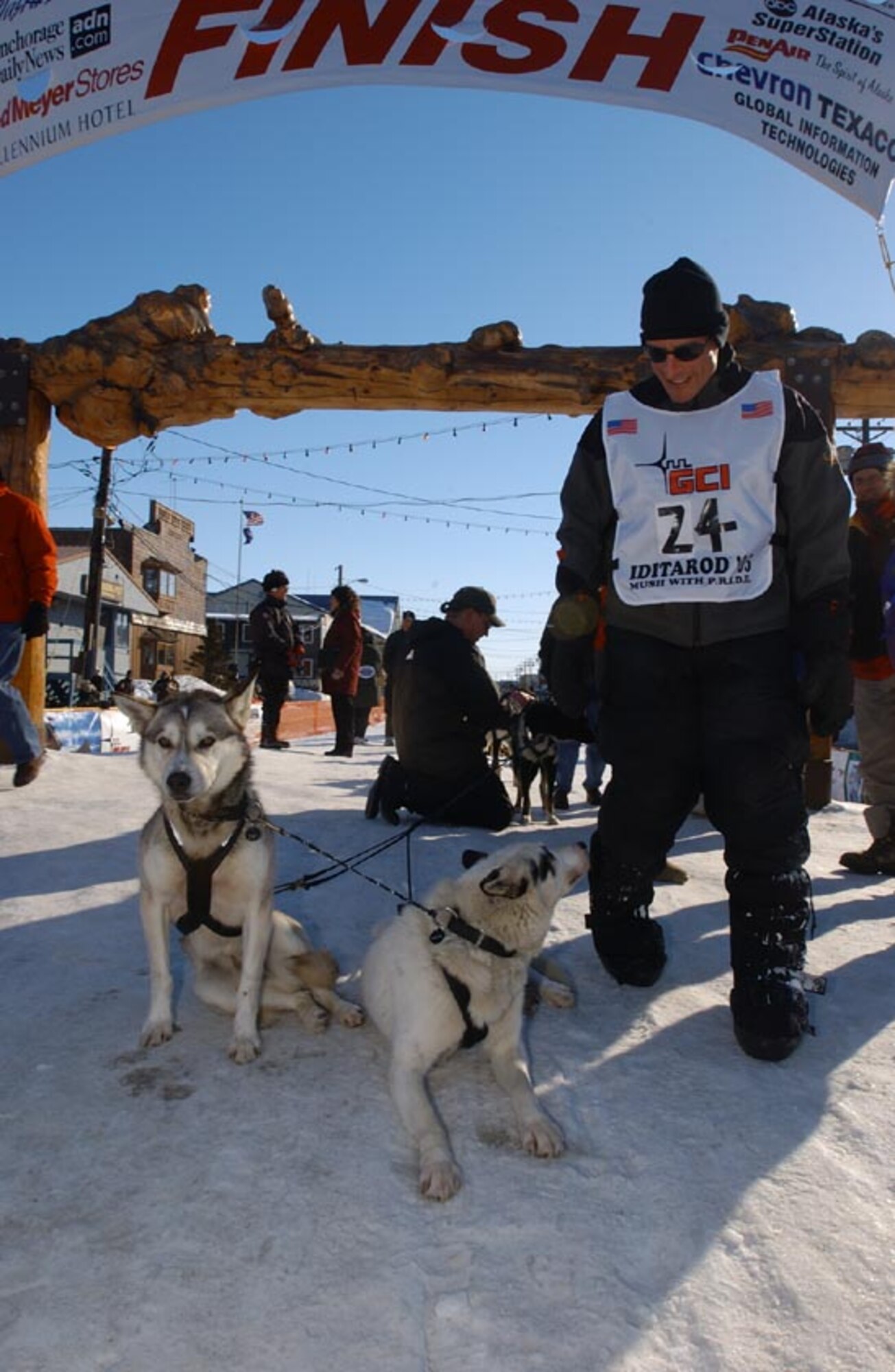 NOME, Alaksa -- Maj. (Dr.) Tom Knolmayer finishes the Iditarod Trail Sled Dog Race on March 20 after 13 days, 22 hours, 13 minutes and 25 seconds on the trail, covering 1,161 miles.  He is chief of surgery at Elmendorf Air Force Base, Alaska.  (U.S. Air Force photo by Tech. Sgt. Keith Brown)
