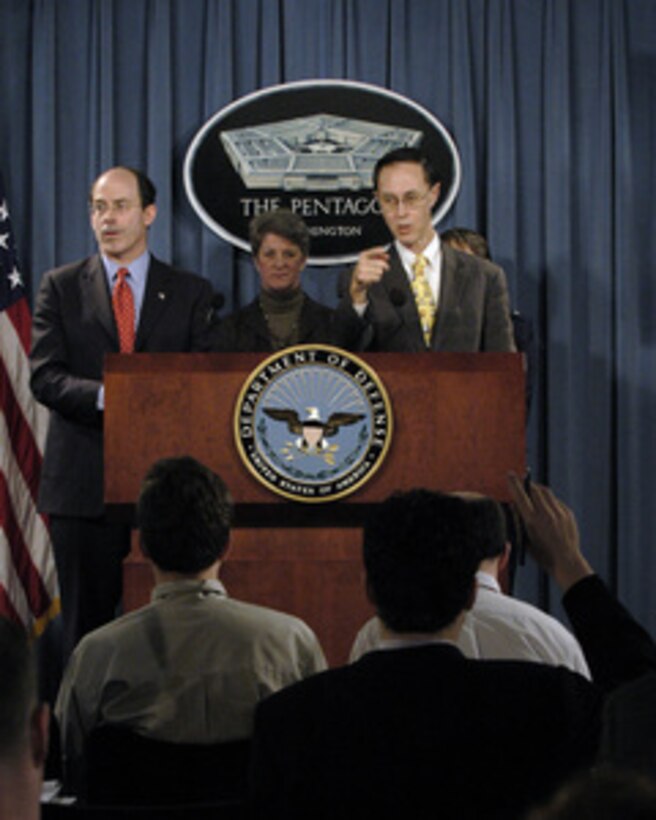 Under Secretary of Defense for Personnel and Readiness David S.C. Chu (right) calls on a reporter with a question during a Pentagon press briefing on the Confidentiality and Service Academy Sexual Assault and Leadership Survey on March 18, 2005. The survey is intended to assist senior Department and Academy leaders, and members of Congress, to identify changes or adjustments to improve future Academy operations, gender climates, and perceptions. From left to right are DoD Inspector General Joseph E. Schmitz, Defense Task Force on Sexual Harassment and Violence at Military Service Academies member Diane Stuart, Chu. 