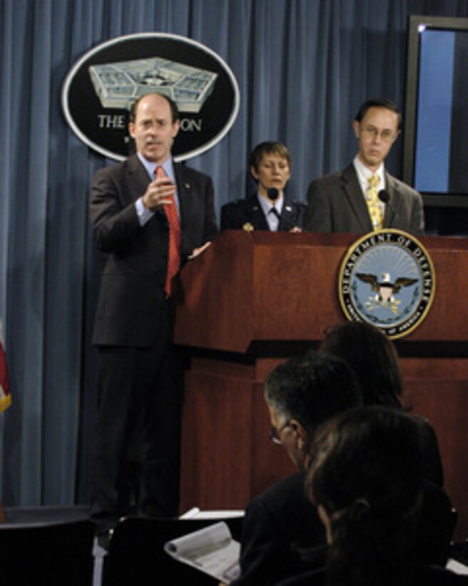 Department of Defense Inspector General Joseph E. Schmitz responds to a reporter's question during a Pentagon press briefing on the Confidentiality and Service Academy Sexual Assault and Leadership Survey on March 18, 2005. The survey is intended to assist senior Department and Academy leaders, and members of Congress, to identify changes or adjustments to improve future Academy operations, gender climates, and perceptions. From left to right are Schmitz, Commander of Joint Task Force on Sexual Assault Prevention and Response Brig. Gen. K.C. McClain, U.S. Air Force, Under Secretary of Defense for Personnel and Readiness David S.C. Chu. 