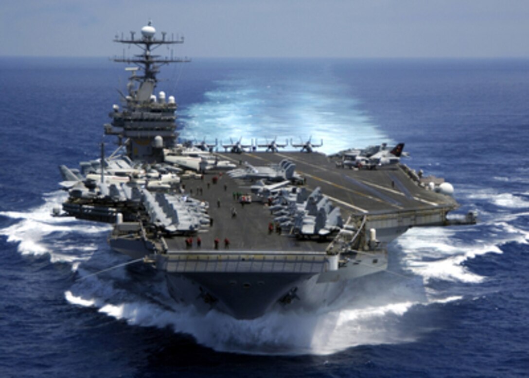 The nuclear powered aircraft carrier USS Carl Vinson (CVN 70) plows through the Indian Ocean as aircraft on its flight deck are prepared for flight operations on March 15, 2005. The Carl Vinson Strike Group is en route to the Persian Gulf to support for Operation Iraqi Freedom. 