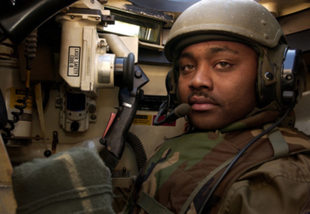 Army Staff Sgt. Leon Gildersleeve, an M1A1 Abrams tank commander from the 1st Squadron, 1st Calvary Regiment, prepares for a live fire exercise at the Rodriguez Live Fire Complex, Republic of Korea, on March 19, 2005. Soldiers from the 1st Squadron, 1st Calvary Regiment, and1st Battalion, 72nd Armored Regiment, are participating in the live fire exercise as a component of exercises Reception, Staging, Onward movement, and Integration/Foal Eagle. The annual, multi-phase exercise is tailored to train, test, and demonstrate U.S. and Republic of Korea force projection and deployment capabilities. 