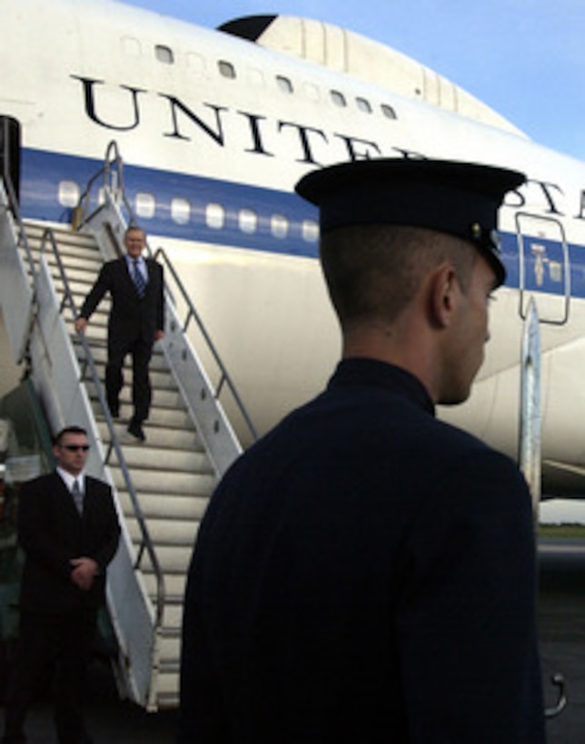 Secretary of Defense Donald H. Rumsfeld descends the steps from his airplane to a waiting honor cordon at the Ministro Pistarini de Ezeiza International Airport in Buenos Aires, Argentina, on March 21, 2005. Rumsfeld is traveling to South and Central America to meet with key government officials and his defense counterparts to strengthen bilateral ties. 