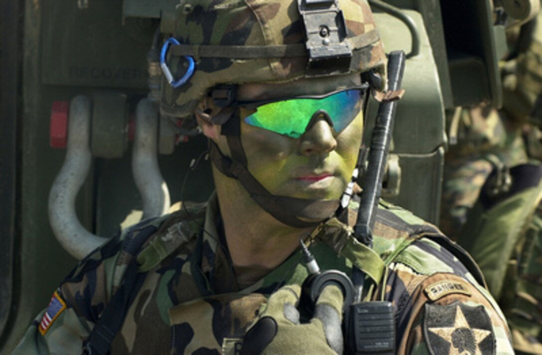 U.S. Army Staff Sgt. Jason Ramsay communicates with his team at Daegu Air Base, Korea, during exercises Reception, Staging, Onward movement, and Integration/Foal Eagle in the Republic of Korea, on March 18, 2005. The annual, multi-phase exercise is tailored to train, test, and demonstrate U.S. and Republic of Korea force projection and deployment capabilities. The annual, multi-phase exercise is tailored to train, test, and demonstrate U.S. and Republic of Korea force projection and deployment capabilities. Ramsay is attached to Alpha Company, 1st Battalion,23rd Infantry Regiment. 