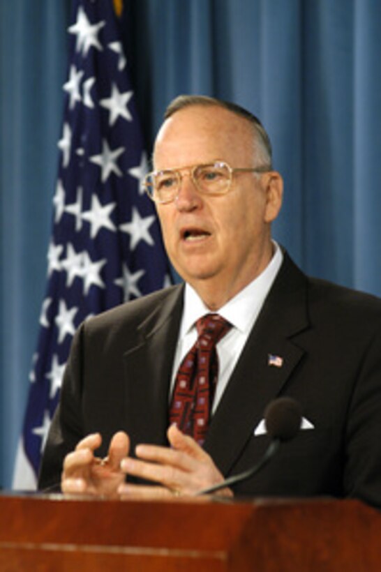Assistant Secretary of Defense for Reserve Affairs Thomas Hall briefs reporters in the Pentagon on a new health care plan for members of the National Guard and reserves on March 24, 2005. The TRICARE Reserve Select program is designed to cover the individual service member as well as his or her dependents and will terminate at the end of the subscriber's service agreement. 