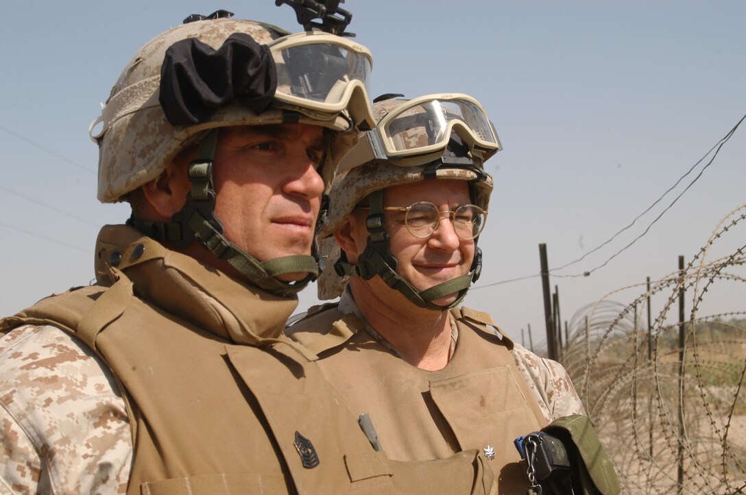 BAGHDAD, Iraq -- (March 24, 2005) - Sgt. Maj. David Bullock, sergant major of the 15th Marine Expeditionary Unit checks for security weaknesses at a vehicle check point with Lt. Col. Jeff Kenney, operations officer of the 15th MEU. The 15th Marine Expeditionary Unit (Special Operations Capable) is currently conducting security and stability operations here in the greater Baghdad area. (Official USMC Photo by Gunnery Sgt. Robert Knoll)