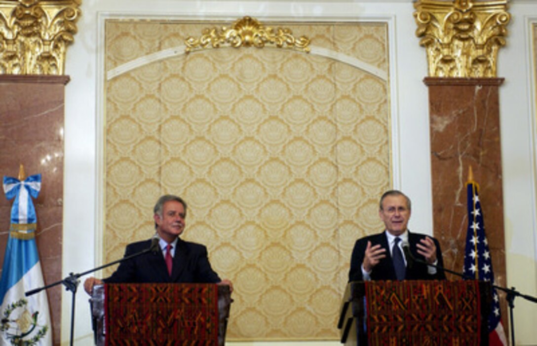 Secretary of Defense Donald H. Rumsfeld (right) answers a reporter's question during joint press conference with Guatemalan President Oscar Jose Rafael Berger Perdomo in Guatemala City, Guatemala, on March 24, 2005. Rumsfeld is traveling to South and Central America to meet with key government officials and his defense counterparts to strengthen bilateral ties. 