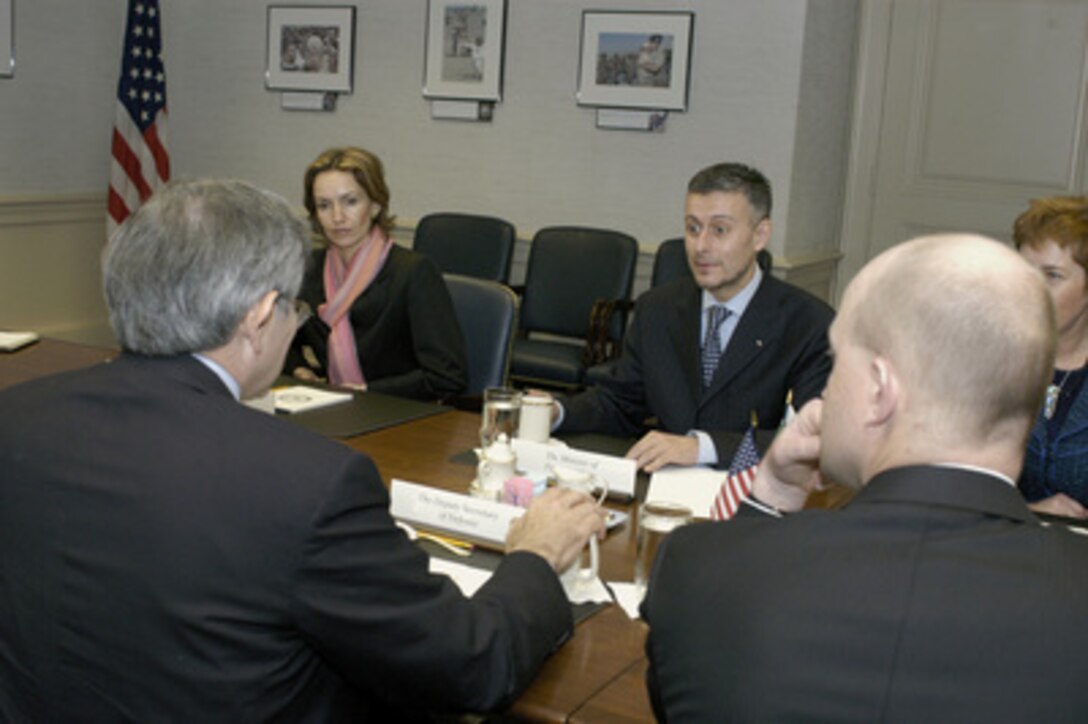 Deputy Secretary of Defense Paul Wolfowitz (foreground left) meets with Bulgarian Minister of Foreign Affairs Solomon Passy (center) on March 25, 2005. Wolfowitz and Passy are meeting in the Pentagon to discuss issues of mutual interest. Passy is accompanied by Deputy Minister of Foreign Affairs Gergana Grancharova (left). 