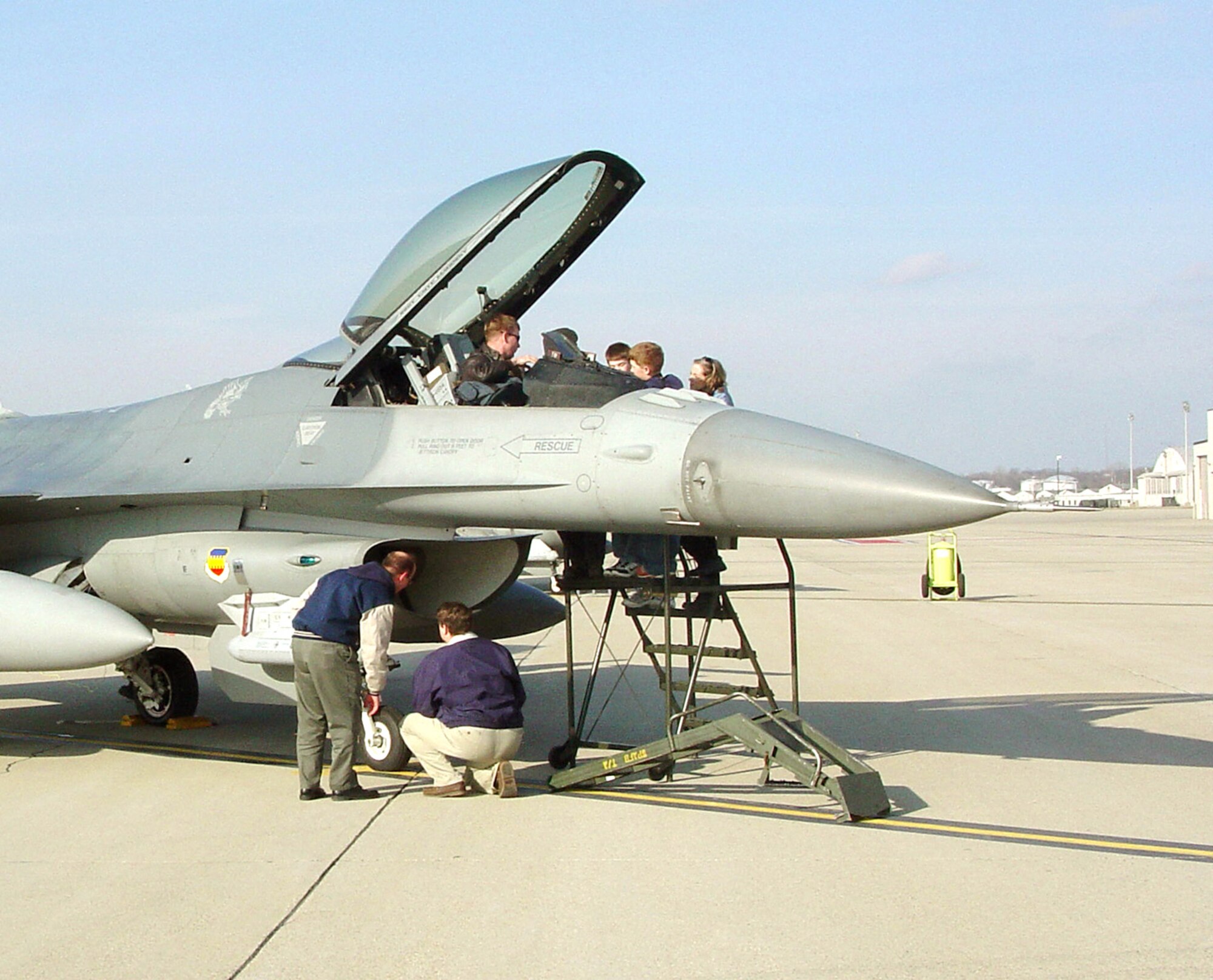WRIGHT-PATTERSON AIR FORCE BASE, Ohio - A newly modified F-16 Fighting Falcon sits on display here for Aeronautical Systems Center's F-16 Systems Group members and their families.  Capt. Jim Govin gave feedback on recent Common Configuration Implementation Program upgrades to the aircraft.  He is an F-16 pilot from the 55th Fighter Squadron at Shaw AFB, S.C.  (U.S. Air Force photo by Susan Ferns)