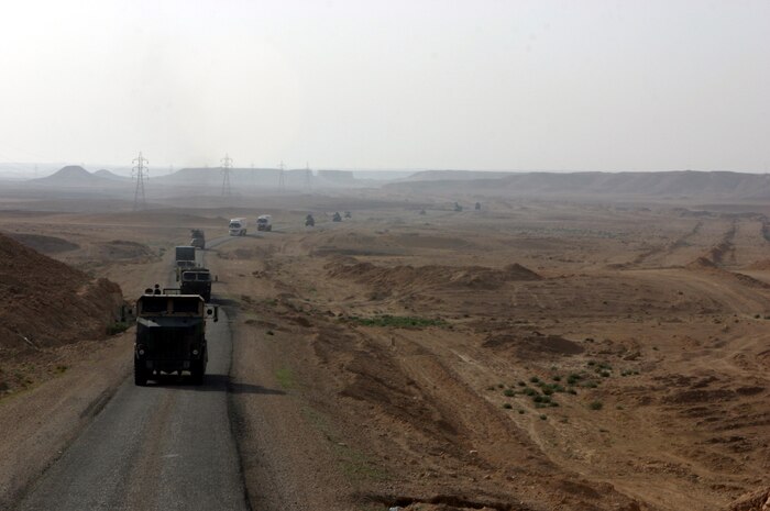 AL ASAD, Iraq - Marines of "Team Carnivore," or Transportation Company, Combat Logistics Battalion - 2, 2d Force Service Support Group (Forward), conduct a convoy from Al Asad to Haditha March 31. The company is comprised of more than 200 Marines from 14 different active-duty and reserve units from around the Marine Corps. They conduct convoy operations on a regular basis, transporting Marines, supplies and equipment throughout the CLB-2 area of operations. (Photo by Cpl. John E. Lawson Jr.)  -30-