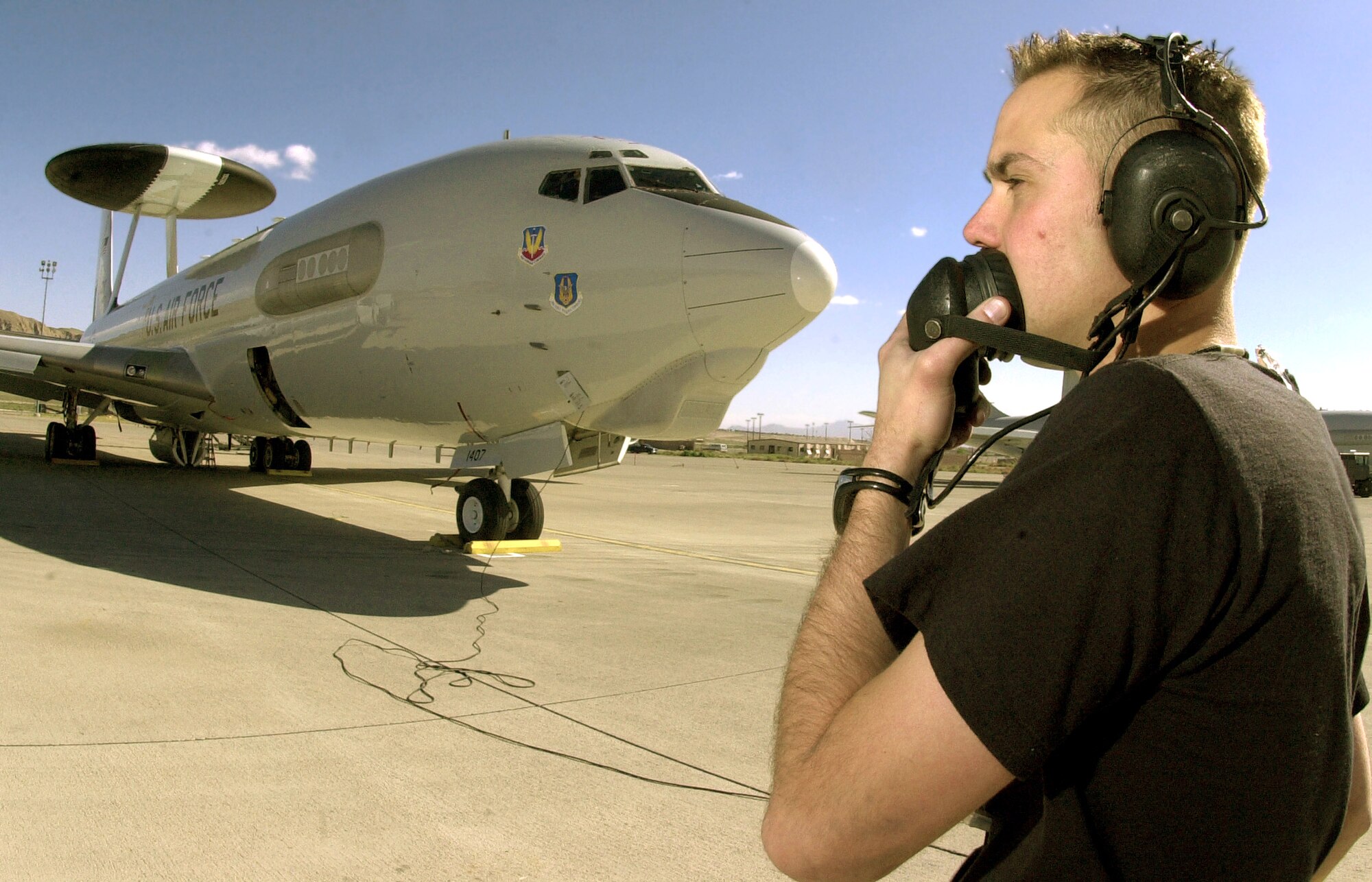 NELLIS AIR FORCE BASE, Nev. -- Staff Sgt. Trevor Wilson prepares an E-3 Sentry Airborne Warning and Control System aircraft for flight during Joint Red Flag 2005 here March 28.  About 10,000 U.S. servicemembers and coalition forces are participating in the exercise here and at Fort Hood, Texas, and Fort Bliss, Texas, until April 2.  Sergeant Wilson is a crew chief with Air Force Reserve Command's 513th Air Control Group from Tinker Air Force Base, Okla.  (U.S. Air Force photo by Tech. Sgt. Patrick M. Kuminecz)
