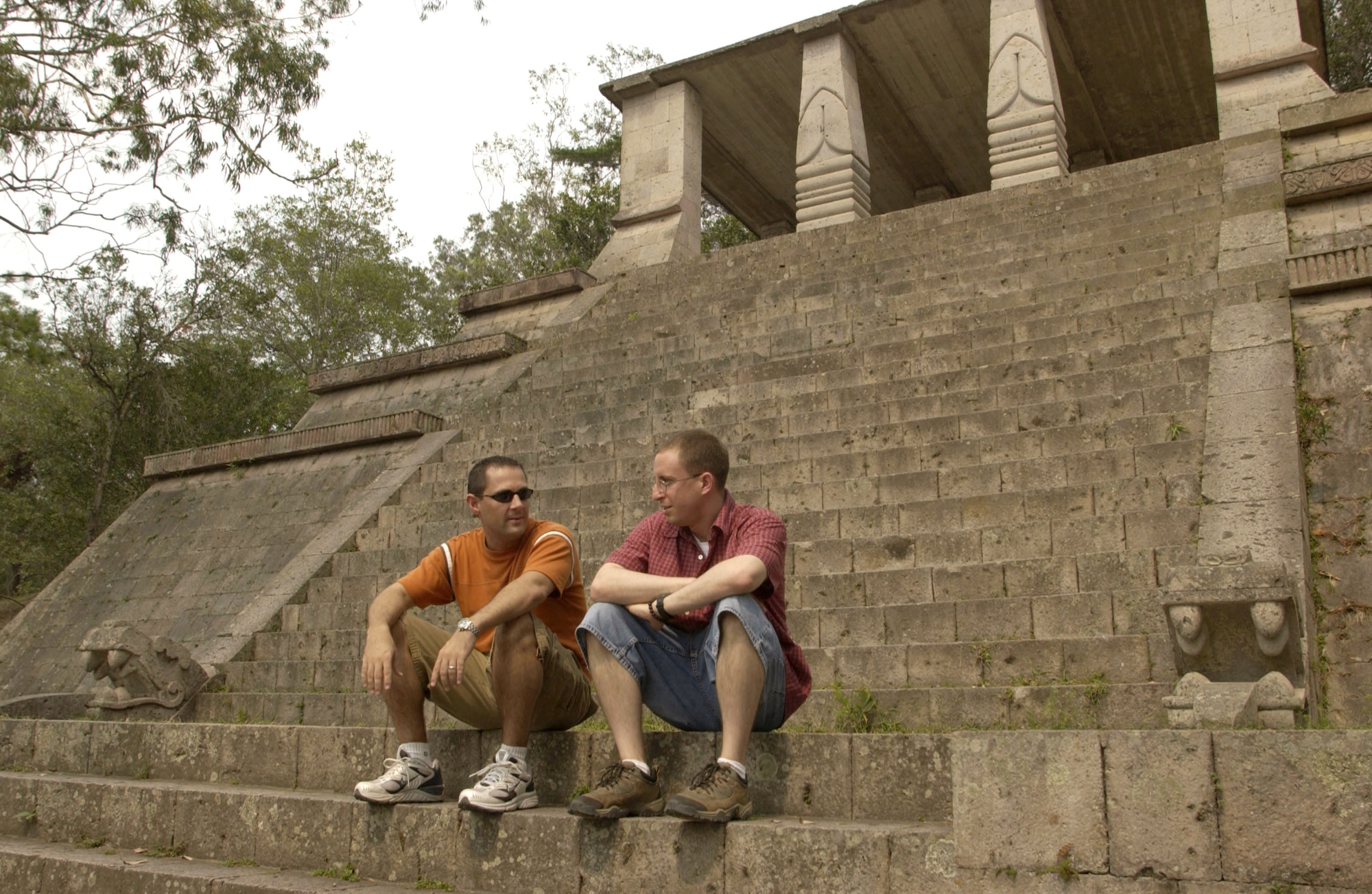 TEGUCIGALPA, Honduras -- Capts. Dan Beard and Cliff Bayne (left to right) chat on the steps of a replica of a Copan Indians temple in United Nations Park, which overlooks the capital city. Both captains are logistics officers for Joint Task Force-Bravo at Soto Cano Air Base, Honduras, and like to visit sites around the country to soak up the local culture and eat the tasty local food. (U.S. Air Force photo by Master Sgt. Lono Kollars)