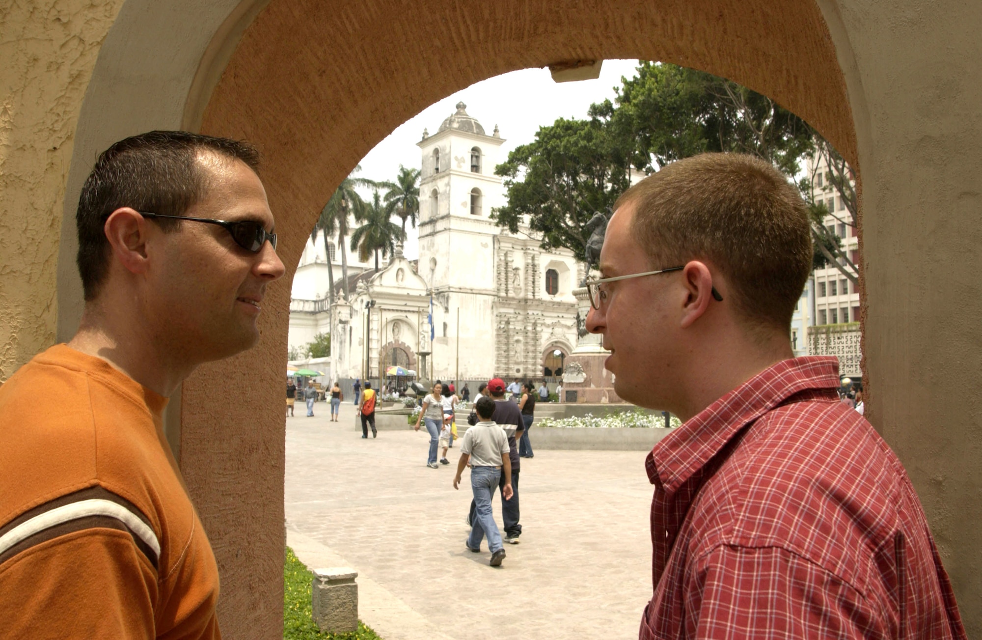 TEGUCIGALPA, Honduras -- Capts. Dan Beard and Cliff Bayne (left to right) discuss where they'll go after their sightseeing tour of the capital city's Plaza Morazan. The logistics officers for Joint Task Force-Bravo at Soto Cano Air Base, Honduras, enjoy visiting different sections of the country when they get a chance. Without getting to know the people and the culture, "you really don't know the country," Captain Bayne said. (U.S. Air Force photo by Master Sgt. Lono Kollars)