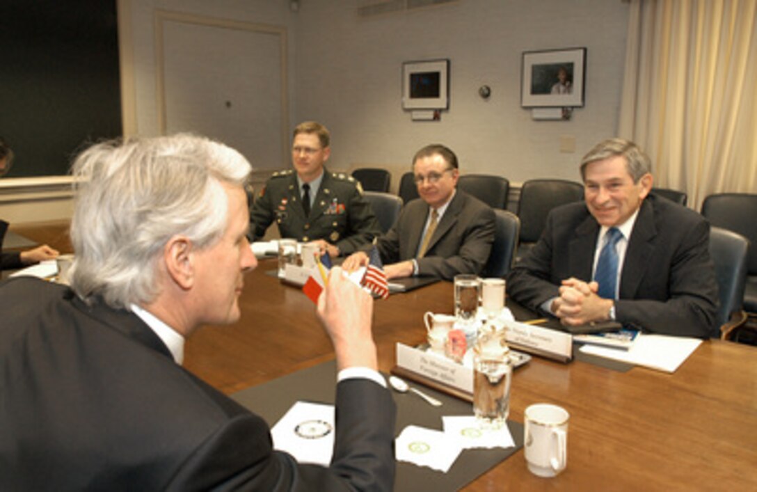 Deputy Secretary of Defense Paul Wolfowitz (right) meets with French Minister of Foreign Affairs Michel Barnier (foreground) in the Pentagon on May 2, 2005. Under discussion are a number of security issues of interest to both nations. Among the participants in the meeting on the U.S. side are DoD country director for France Maj. James Bogle (left), and Director for Northern European Policy Jess Kelso (center). 