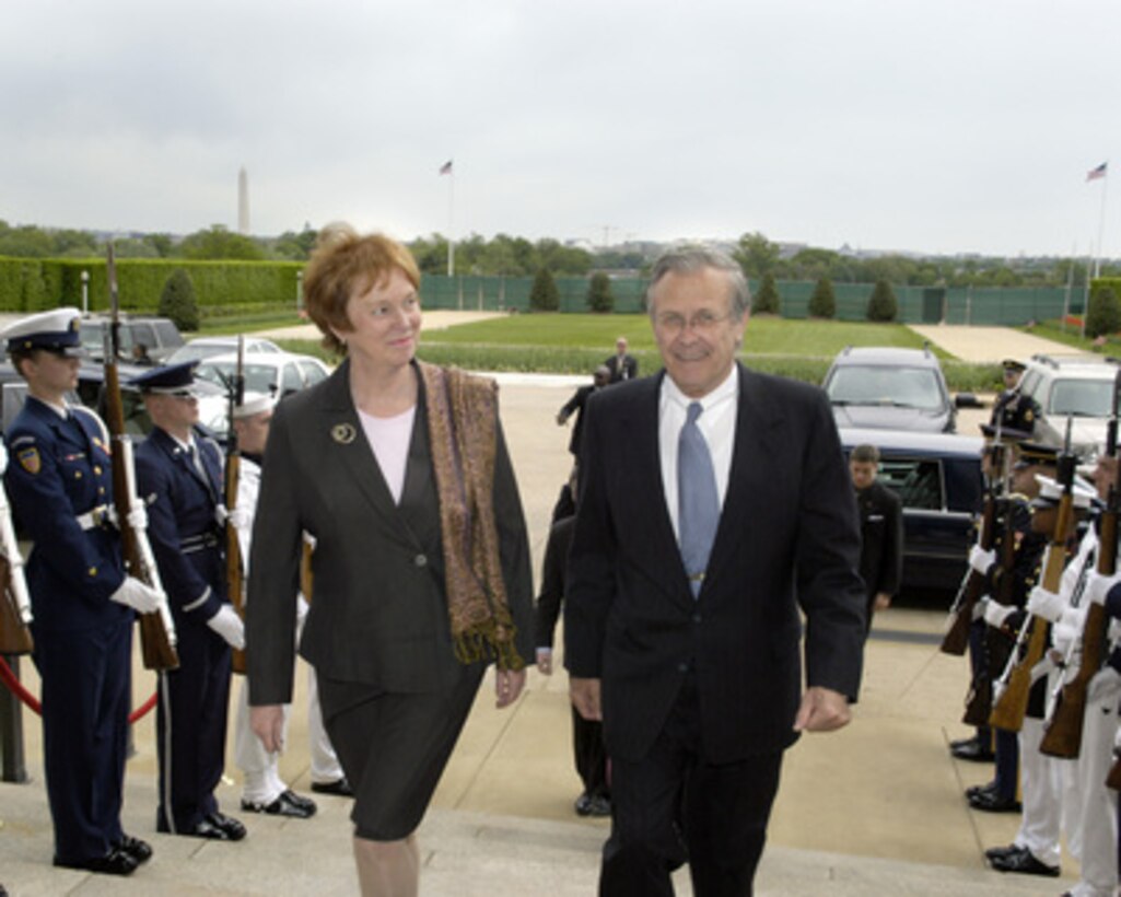 Swedish Minister of Defense Leni Bjorklund (left) is escorted through an honor cordon and into the Pentagon by Secretary of Defense Donald H. Rumsfeld on May 2, 2005. Bjorklund and Rumsfeld will meet to discuss defense issues of mutual interest. 