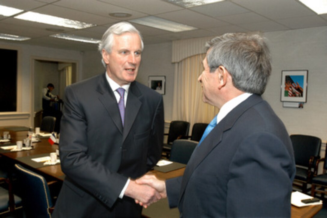 French Minister of Foreign Affairs Michel Barnier (left) is welcomed to the Pentagon by Deputy Secretary of Defense Paul Wolfowitz (right). Barnier and Wolfowitz will meet to discuss a number of security issues of mutual interest to both nations. 