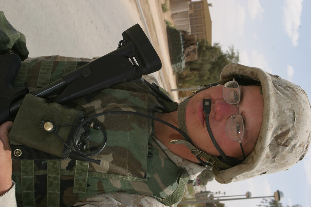 April 4, 2005 Corporal David S. Kosir keeps a vigilant eye over traffic entering a leaving a military compound on Al Asad, Iraq. Cpl. Kosir is a trombone player in the 2D Marine Aircraft Wing Band. While forward deployed the bands primary mission is to provide security. (USMC photo by Cpl. Alicia M. Garcia)