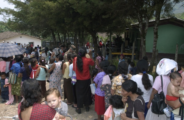RAUTECA, Honduras -- Hundreds of patients line up in the afternoon heat here waiting for a free medical examination from U.S. military medical practitioners. The patients come from miles around to take advantage of a temporary free clinic set up as part of a medical readiness exercise in the town. The 18-person Air Force and Army contingent of pediatricians, dieticians and medical technicians came from the San Antonio area for the eight-day humanitarian exercise. (U.S. Air Force photo by Master Sgt. Lono Kollars)