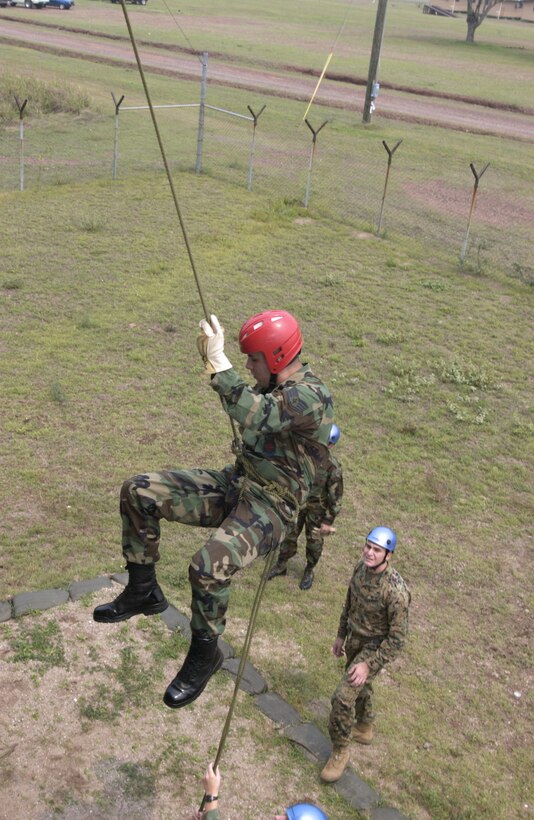 SOTO CANO AIR BASE, Honduras -- Staff Sgt. John Deese rappels during a search and rescue training exercise here May 3. Each week the SAR team conducts different training exercises to prepare for operations throughout Central America.  The team is Army run, but relies heavily on Airmen and Marines to ensure mission success. Sergeant Deese is a crew chief with the base fire department. (U.S. Air Force photo by Master Sgt. Lono Kollars)