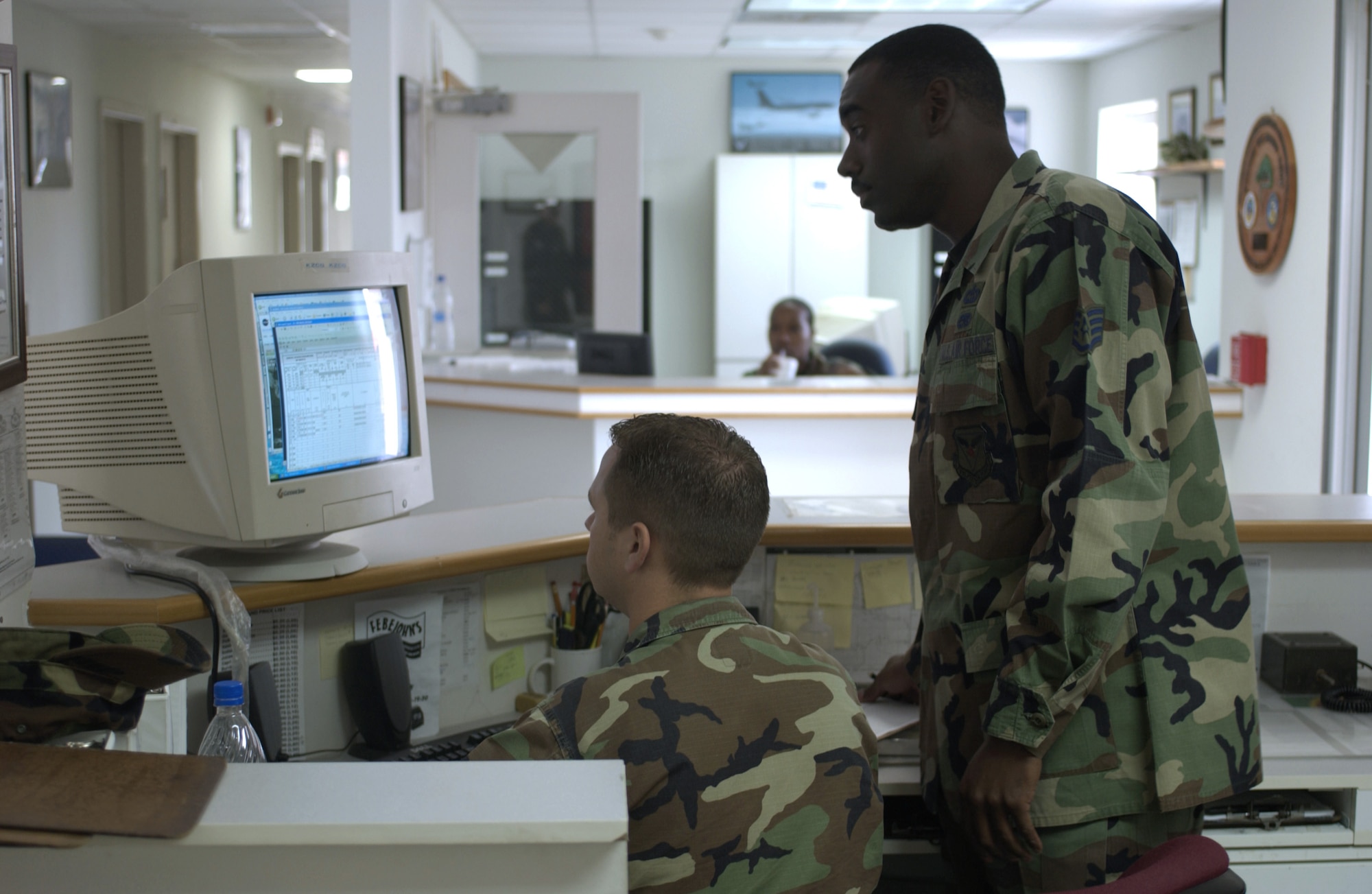 SOTO CANO AIR BASE, Honduras -- Staff Sgts. Joshua Smith (left) and James Brown check the five-day forecast for here and Central America.  The Airmen are weather forecasters with Joint Task Force-Bravo and are some of the Airmen responsible for keeping the base runway open for counterdrug and humanitarian support operations.  (U.S. Air Force photo by Master Sgt. Lono Kollars)