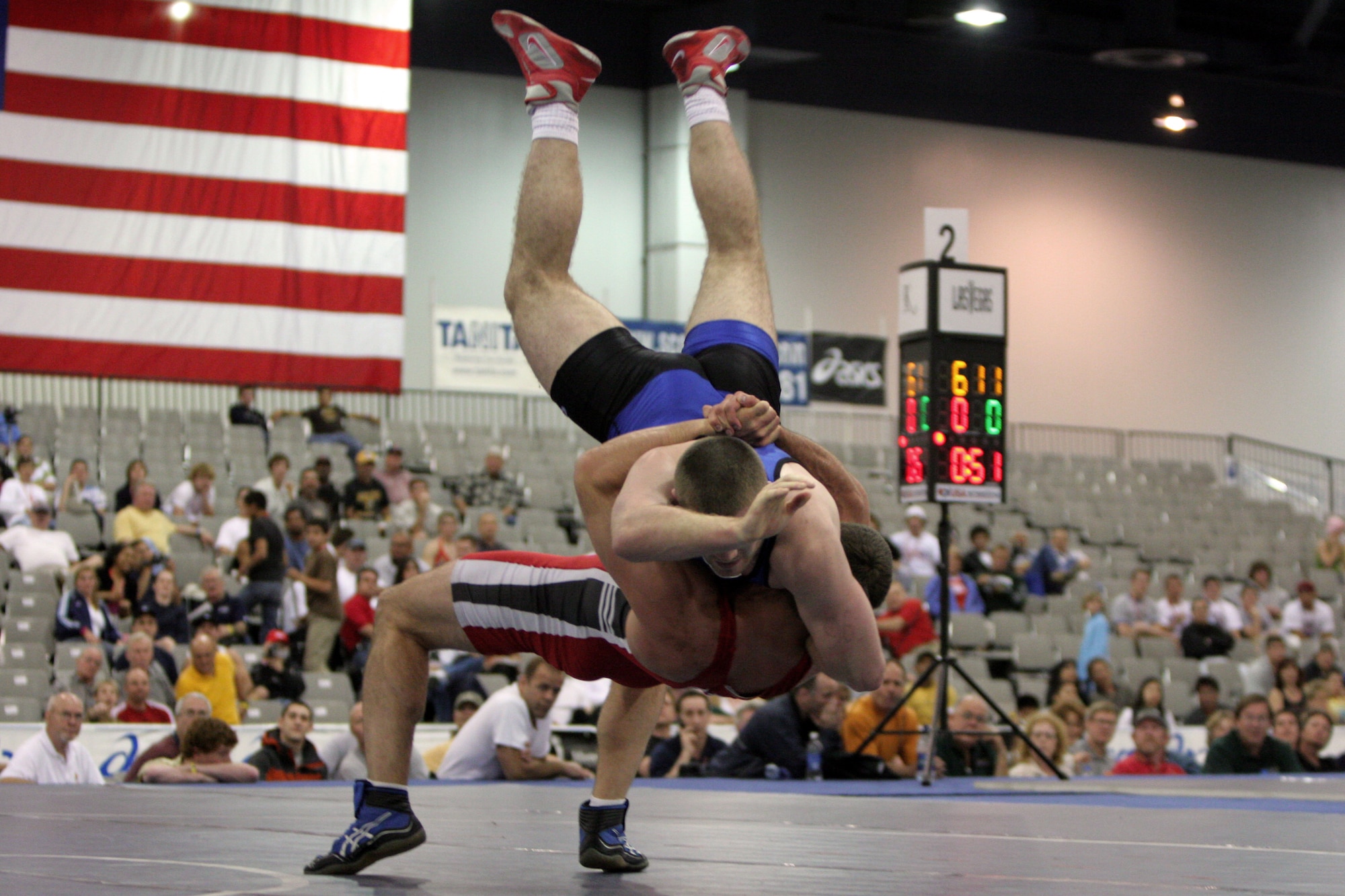 LAS VEGAS -- Philip Johnston (bottom), a 211.2-pound division Greco-Roman wrestler, pulls off a lift and throw on his opponent, J.D. Bergman of the Ohio International Wrestling Club, during a consolation match of the 2005 U.S. Nationals Wrestling tournament held here April 29.  Johnston won the match 5-0, 8-0, and took 3rd place in his weight class.  (U.S. Air Force photo by Master Sgt. Robert W. Valenca)