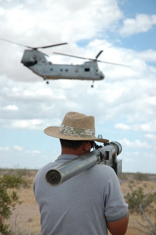 Dahn Green, electrnoics operator, takes aim at a Ch-46 helicopter using a SA-16 Portable Air Defense Simulator May 6 at Auxilirary site 2.