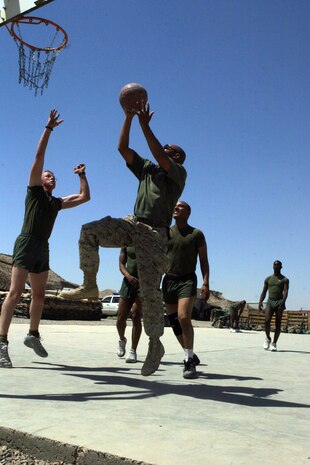CAMP FALLUJAH, Iraq -- Gunnery Sgt. Gregory Williams, a Frost, Texas, native and company gunnery sergeant for Maintenance Company, Combat Logistics Battalion 8, 2d Force Service Support Group (Forward), goes for a lay-up, playing basketball with the Marines of Maint. Co.