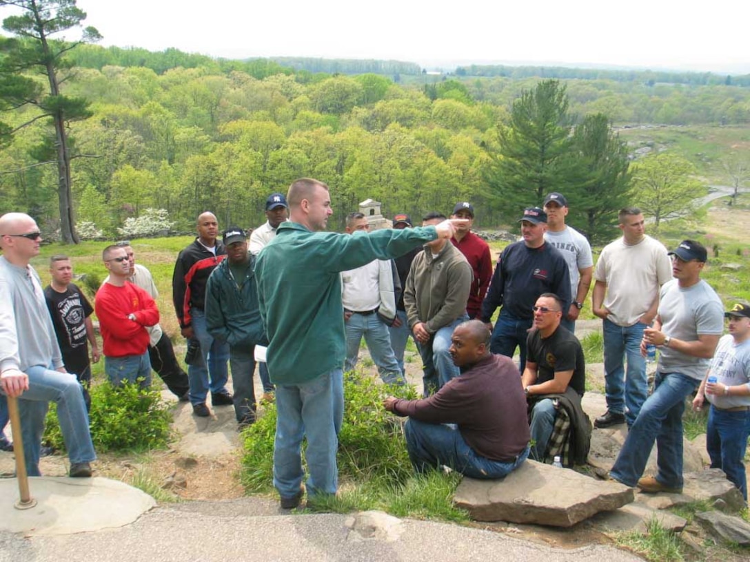 Major J. J. Dill, commanding officer of Recruiting Station New York, briefed at Little Round Top after  SNCOICs hiked up the hill at Gettysburg. The SNCOICs and command group of RS N.Y., recently visited Gettysburg for a one-day conference.