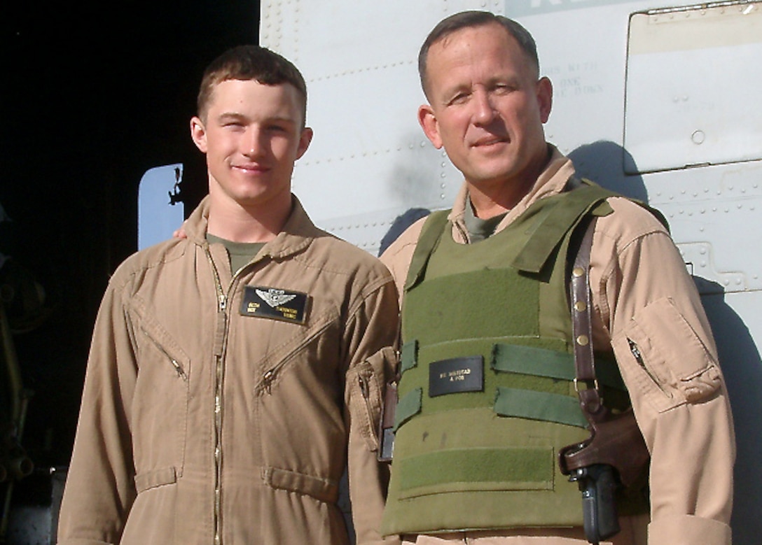 AL ASAD, Iraq - Sgt. Seth Thornton, a CH-53E Super Stallion crewchief assigned to Marine Heavy Helicopter Squadron 465 and Abilene, Texas, native, poses for a photograph with Brig. Gen. Robert E. Milstead Jr., 2nd Marine Aircraft Wing (Forward) commanding general, before flying together during one of the many missions assigned to the squadron May 10.  Thornton, in his third deployment in support of Operation Iraqi Freedom, had the opportunity to fly with Milstead, a fellow Texan who also calls Abilene home.