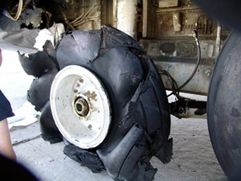 BAGRAM AIR BASE, Afghanistan -- The damaged tire of a C-130 Hercules assigned to the 774th Expeditionary Airlift Squadron at Karshi-Khanabad Air Base, Uzbekistan, is shown after landing here April 4.  (U.S. Air Force photo)