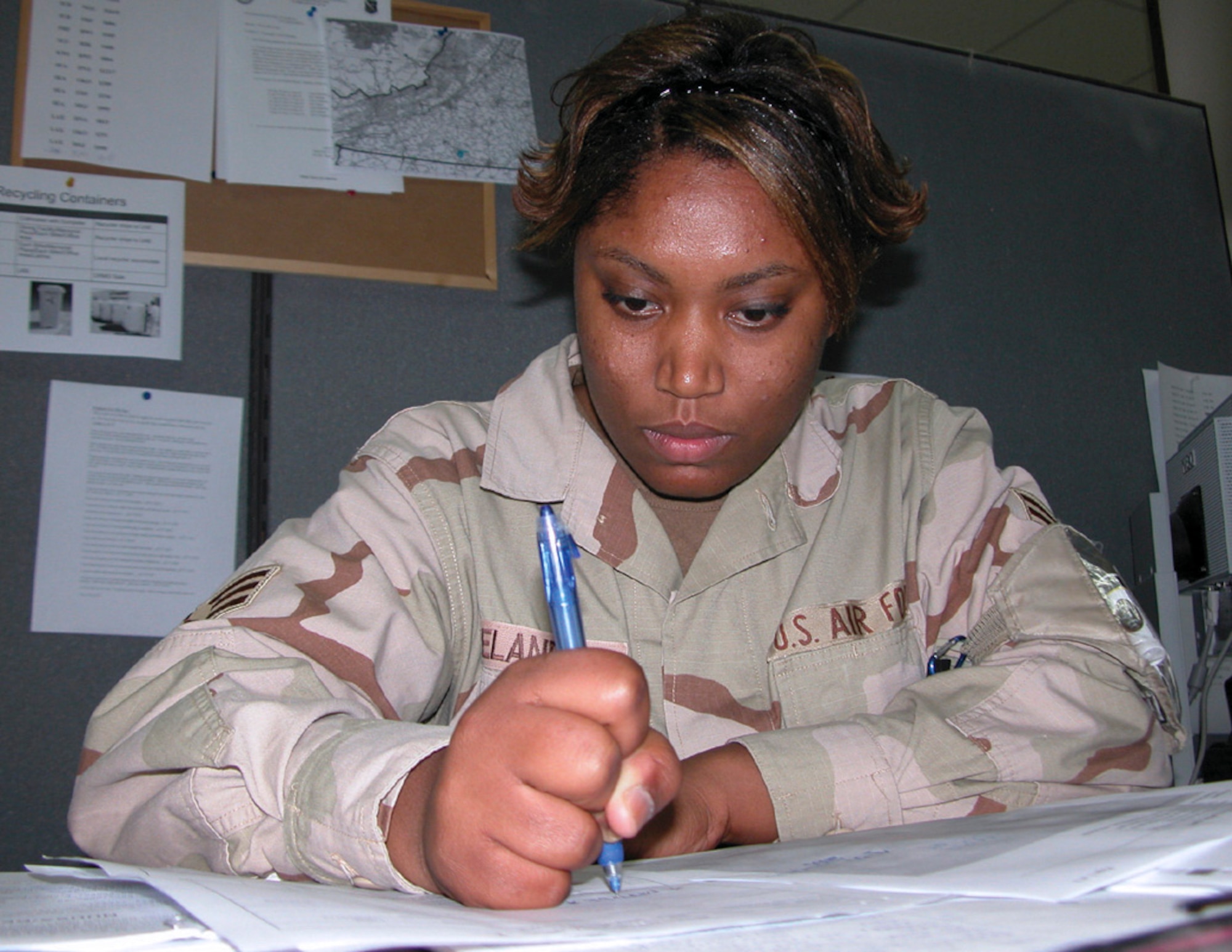 SOUTHWEST ASIA -- Senior Airman Latasha Ireland completes paperwork at a forward-deployed location.  She is a 379th Expeditionary Logistics Readiness Squadron traffic management specialist deployed from Ellsworth Air Force Base, S.D.  (U.S. Air Force photo by Senior Airman Karah Manning)