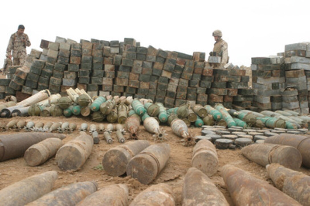 Artillery shells, mortar rounds, land mines and thousands of rounds of small arms ammunitions make up one of the 20 weapons caches that U.S. Marines from India Company, 3rd Battalion, 4th Marine Regiment found during security and stabilization operations in the Al Anbar Province, Iraq, on April 26, 2005. Explosive ordnance disposal technicians will destroy the munitions. 