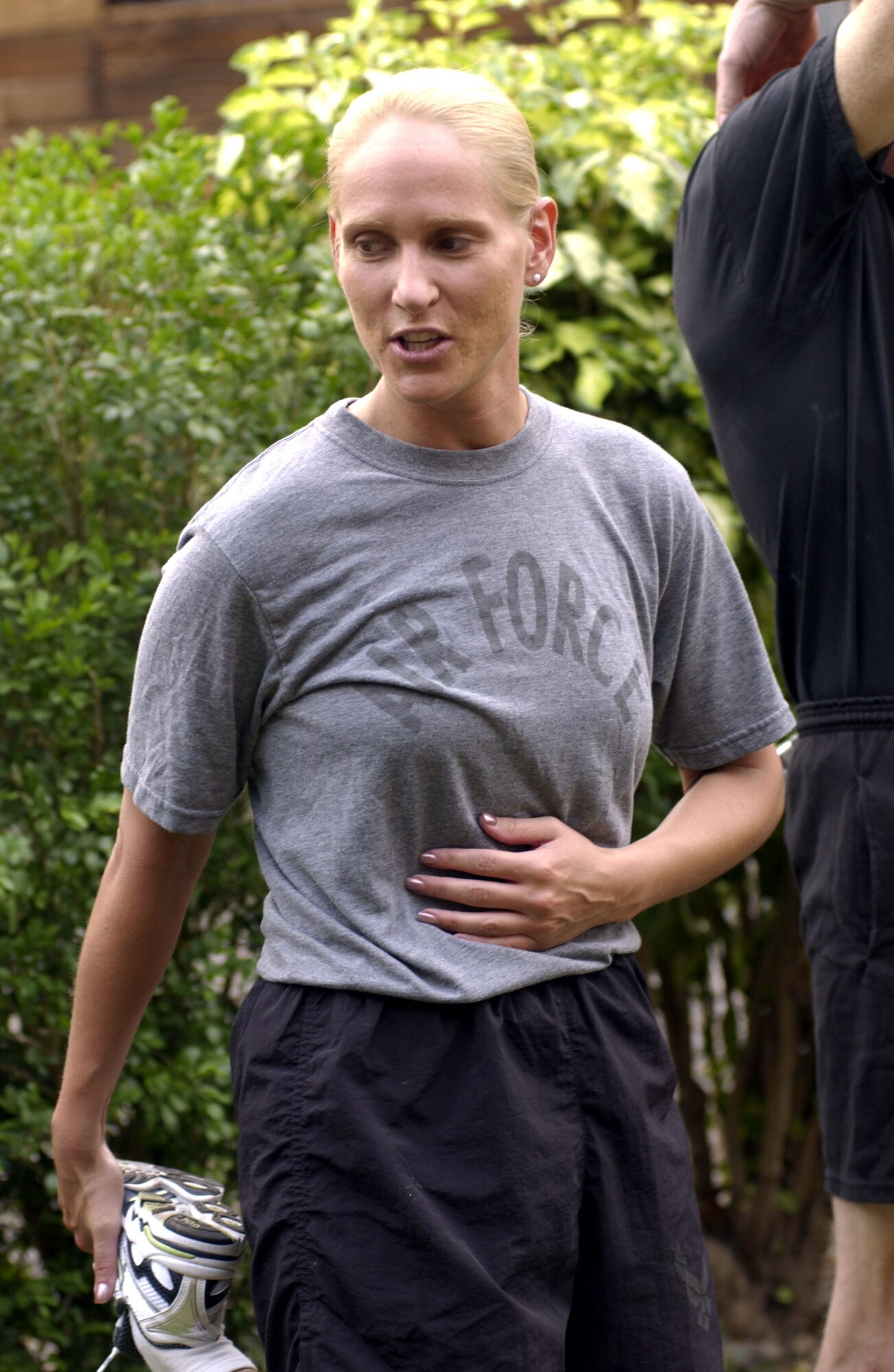 SOTO CANO AIR BASE, Honduras -- First Lt. Kellie Courtland stretches before her daily run.  The lieutenant set a goal of running 1,500 miles before she leaves here.  She said running in the extreme heat and humidity has helped her train for competing in the states.  She has completed four marathons while serving as the officer in charge of the subarea petroleum office for Joint Task Force-Bravo.  (U.S. Air Force photo by Master Sgt. Lono Kollars)