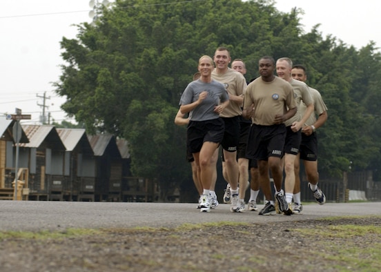 SOTO CANO AIR BASE, Honduras -- First Lt. Kellie Courtland leads her running team, "The Spa Girls," around the base.  The lieutenant set a goal of running 1,500 miles before she leaves here.  She said running in the extreme heat and humidity has helped her train for competing in the states.  She has completed four marathons while serving as the officer in charge of the subarea petroleum office for Joint Task Force-Bravo.  (U.S. Air Force photo by Master Sgt. Lono Kollars)