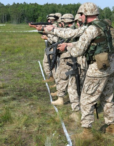 Marines from Transportation Support Company, Combat Logistics Battalion 6, 2nd Marine Logistics Group (Fwd), prepare to depart for Saqlawiyah, Iraq to fortify an Iraqi Police Station. During the mission, the Marines placed eight 10,000-pound barriers around the building. The Marines also delivered 500 gallons of diesel fuel and repaired and recovered a logistics vehicle system.