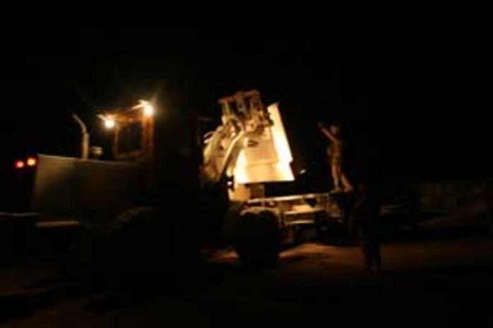 Marines from Transportation Support Company loaded a total of 80,000 pounds of concrete barriers on trucks in order to deliver them to Saqlawiyah, Iraq and fortify an Iraqi Police Station.