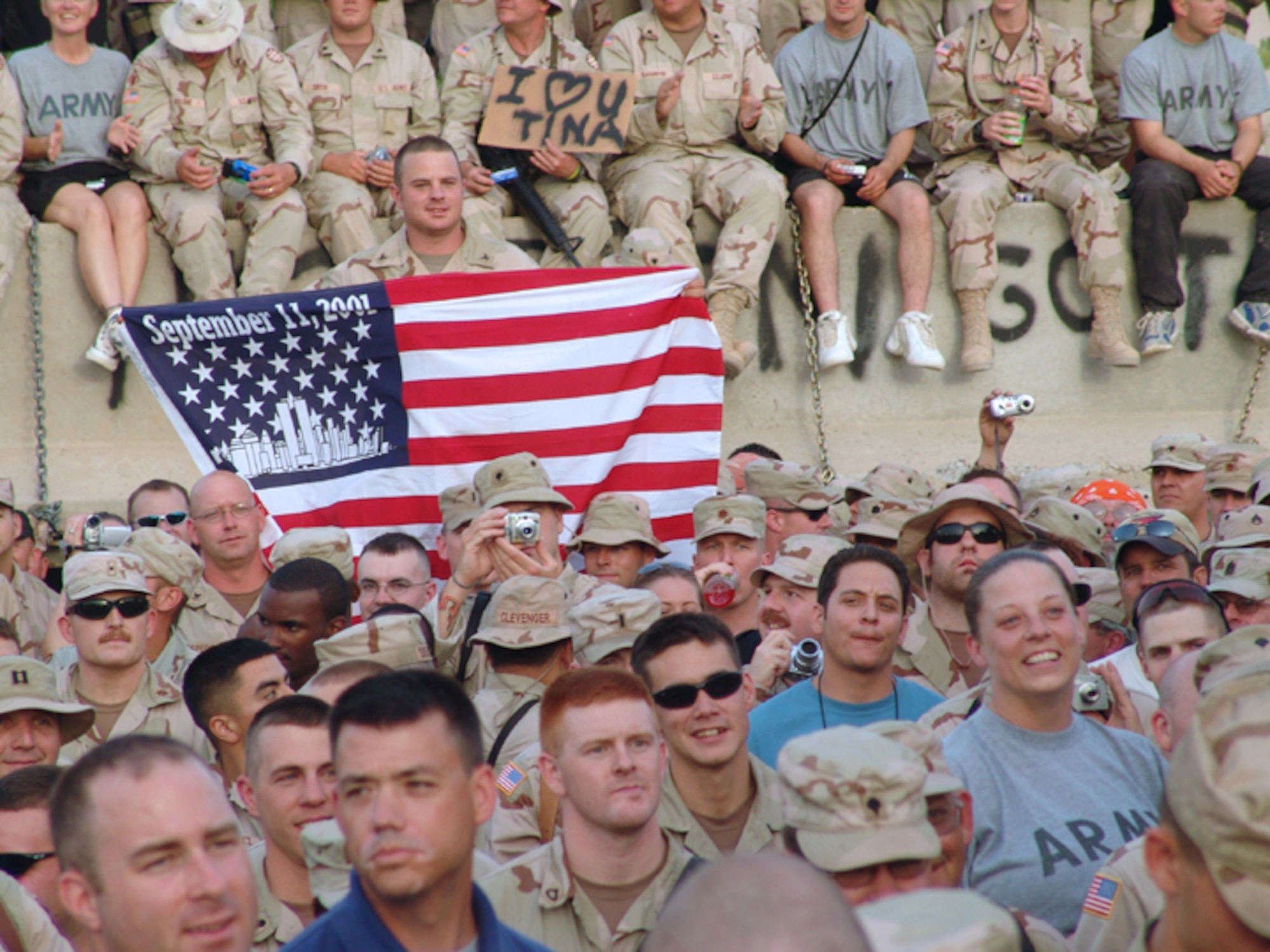 BAGHDAD, Iraq -- Soldiers, Sailors, Airmen and Marines take a respite from deployed life to enjoy a concert put on by country music star Toby Keith on May 17.  (U.S. Air Force photo by Tech. Sgt. Brian Davidson)