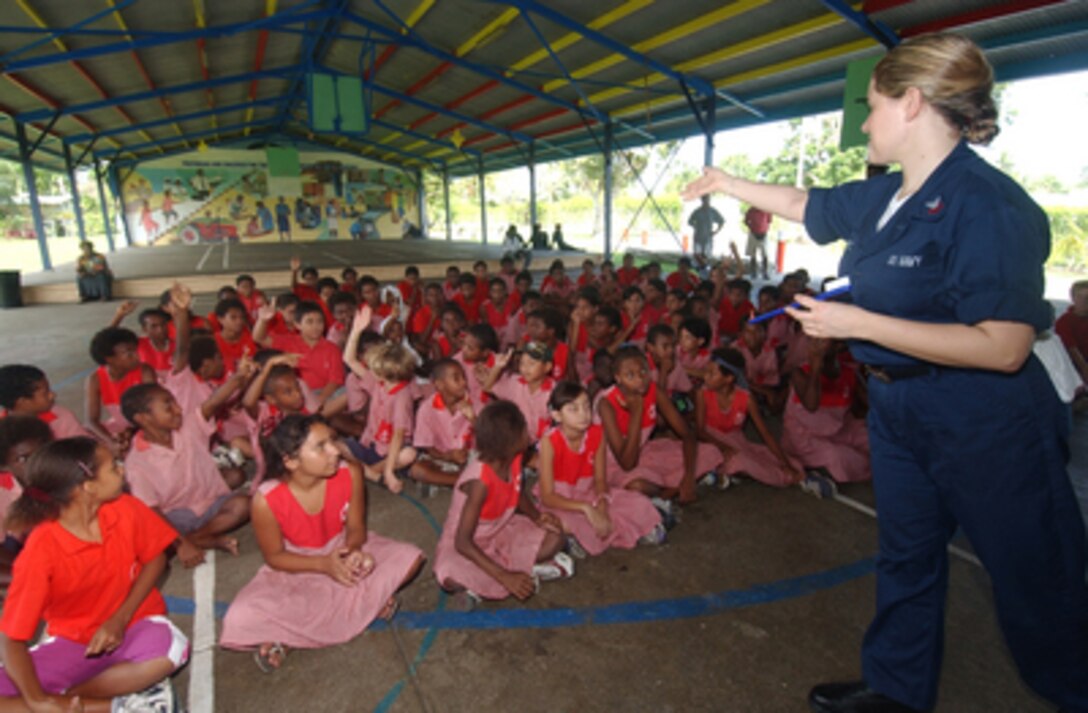 Dental Technician 2nd Class Deborah McLeod engages the students of the Modilion International School in Madang, Papua, New Guinea, during a question and answer period as she instructs the students in the proper use of a toothbrush on May 17, 2005. U.S. Navy medical personnel assigned to the hospital ship USNS Mercy (T-AH 19) visited schools throughout the city of Madang to teach students the importance of disease prevention, dental hygiene and proper diet. The Mercy and combat stores ship the USNS Niagara Falls (T-AFS 3) are on station off the coast of New Guinea to provide humanitarian assistance and focused medical care to the residents of the area. 