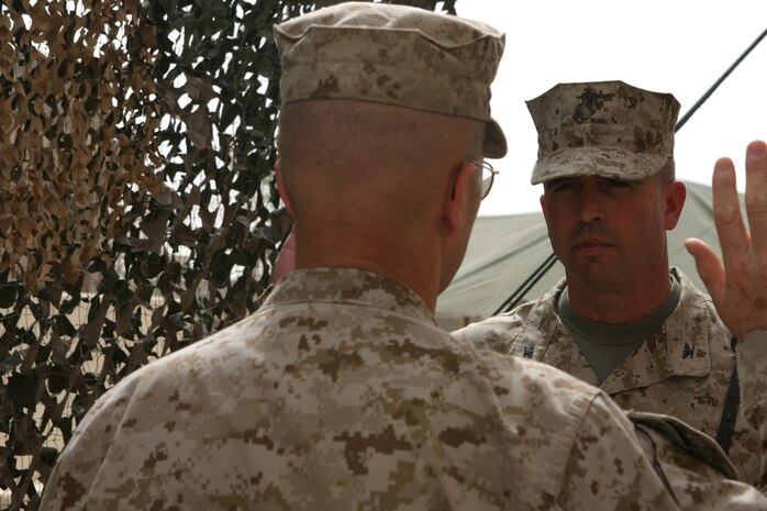 CAMP TAQADDUM, Iraq (May 18, 2005) – Brigadier Gen John E. Wissler, commander of 2d Force Service Support Group (Forward), takes the oath of enlistment during his frocking ceremony here May 18 to his current rank.  Major Gen. Stephen T. Johnson, commanding general of II Marine Expeditionary Force (Fwd), preceded the Brooklyn Park, Minn., native’s frocking ceremony. (Photo by Sgt. Kristin S. Jochums)