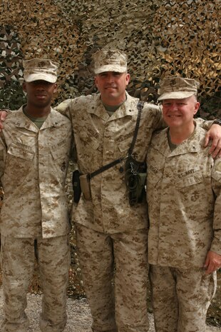 CAMP TAQADDUM, Iraq (May 18, 2005) – Private first class Jamond D. Roberts (left), a Cheneyville, La., native, Brig. Gen. John E. Wissler, commander of 2d Force Service Support Group (Forward) and Brooklyn Park, Minn., native, and Lt. Cmdr. Timothy D. Hogan, Combat Logistics Regiment 25, chaplain and Southgate, Mich., native, pose for a picture after Wissler’s frocking ceremony here May 18. (Photo by Sgt. Kristin S. Jochums)