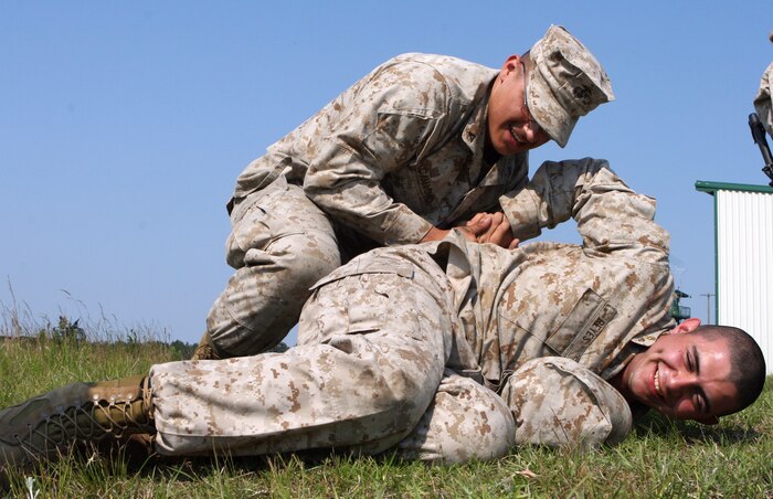 FALLUJAH, Iraq (March 20, 2007) ? Marines from Transportation Support Company make a stop to refuel as the sun rises after an all-night mission in which they delivered 500 gallons of diesel fuel, recovered a logistics vehicle system and installed eight 10,000-pound barriers around an Iraqi Police Station in Saqlawiyah.
