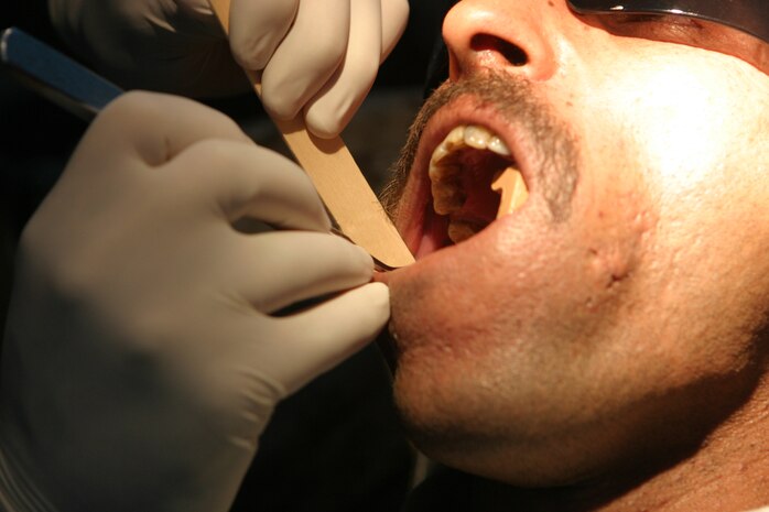 CAMP TAQADDUM, Iraq (May 23, 2005) -  Sailors from Headquarters and Service Battalion, 2d Force Service Support Group (Forward) performed a humanitarian assistance mission for Iraqi Intervention Force soldiers in Habbaniyah May 20 and 21. The IIF soldiers had complained of pain and were in need of dental care. (Photo by Cpl. John E. Lawson Jr.)