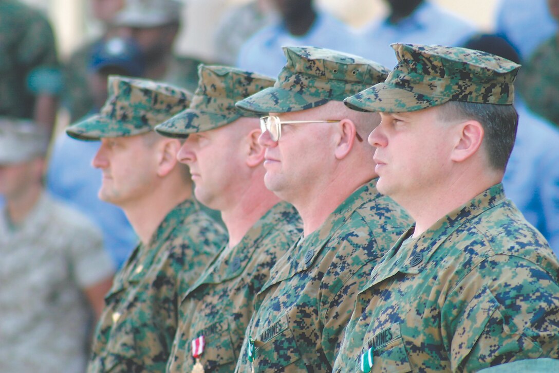 Cpl. Micah Snead Major Larry L. Fowler, operations officer, Marine Aviation Logistics Squadron 31, stands with Master Sgts. Mark W. Thaler and John M. Jones and Gunnery Sgt. Shawn F. Smith while the three Marines prepare to be dismissed from their retirement ceremony, May 20.