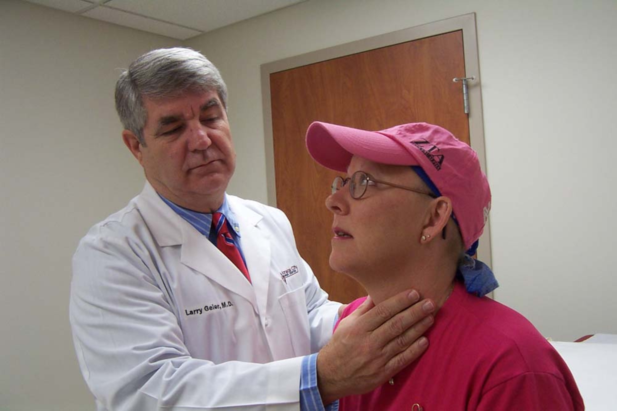 WHITEMAN AIR FORCE BASE, Mo. -- Dr. Larry Geier examines Master Sgt. Dee Ann Poole, who is battling breast cancer.  Sergeant Poole started a cancer support group here and is assigned to the 509th Bomb Wing public affairs office.  (U.S. Air Force photo by Andrea Ernst)