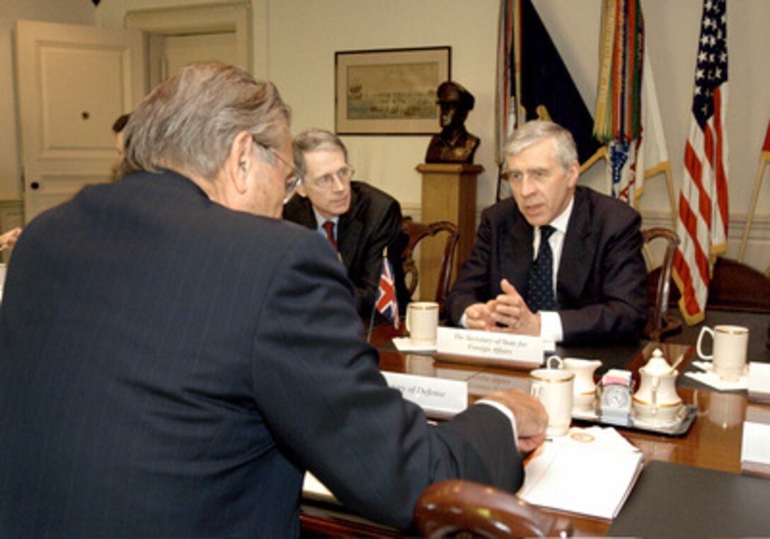 British Foreign Secretary Jack Straw (right) meets with Secretary of Defense Donald H. Rumsfeld (foreground) in the Pentagon on May 19, 2005. A number of bilateral security issues were discussed. Straw and United Kingdom Ambassador to the United States Sir David Manning (center) represented Britain. 