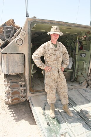 Marines from Engineer Company, Combat Logistics Battalion 6, 2nd Marine Logistics Group (Fwd), place a concertina wire fence around an Iraqi Police Station in southwest Fallujah, Iraq. During the mission, the company also repaired a pothole in front of the station, bulldozed an adjacent building that insurgents have been known to use for hiding, and disposed of unexploded ordnance discovered nearby.