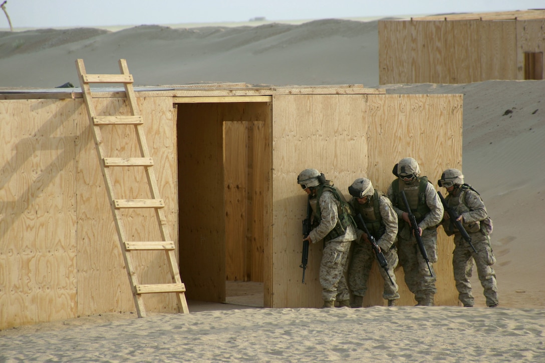 Marines of Combined Anti-Armor Team "Alpha", Weapons Company, Battalion Landing Team, 2nd Bn., 8th Marines, 26th Marine Expeditionary Unit (Special Operations Capable), practice room clearing prior to a live fire exercise at Udairi Range, Camp Buehring, Kuwait. Marines of the 26th MEU will continue live fire exercises in preparations for follow-on operations in the region. (USMC photo by Cpl. Eric R. Martin)(Released)