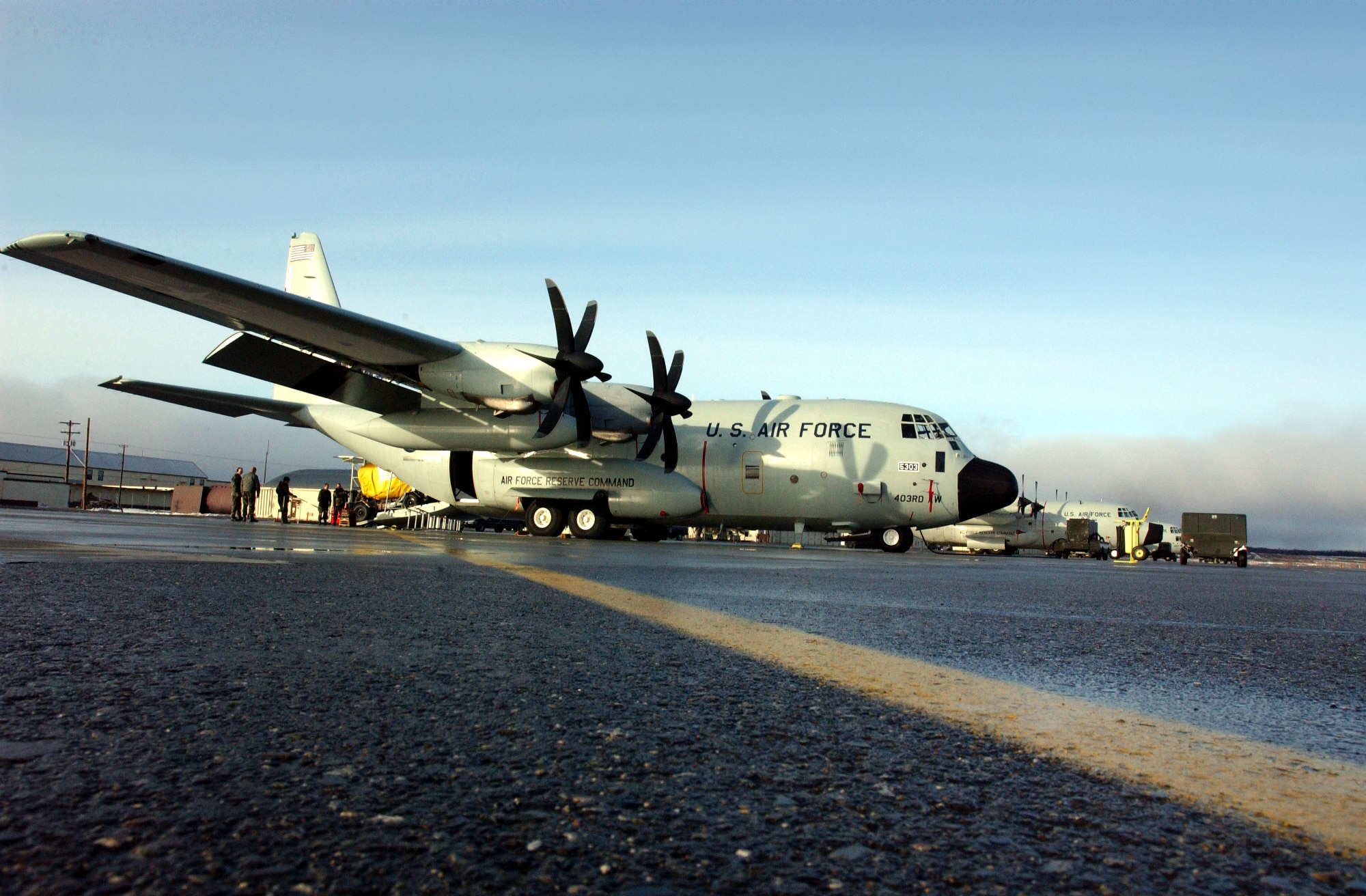 A WC-130J on the apron at Elmendorf Air Force Base, Alaska, in 2003. The J-model allows aircrews to fly higher improving the winter storm forecast models. (U.S. Air Force photo)